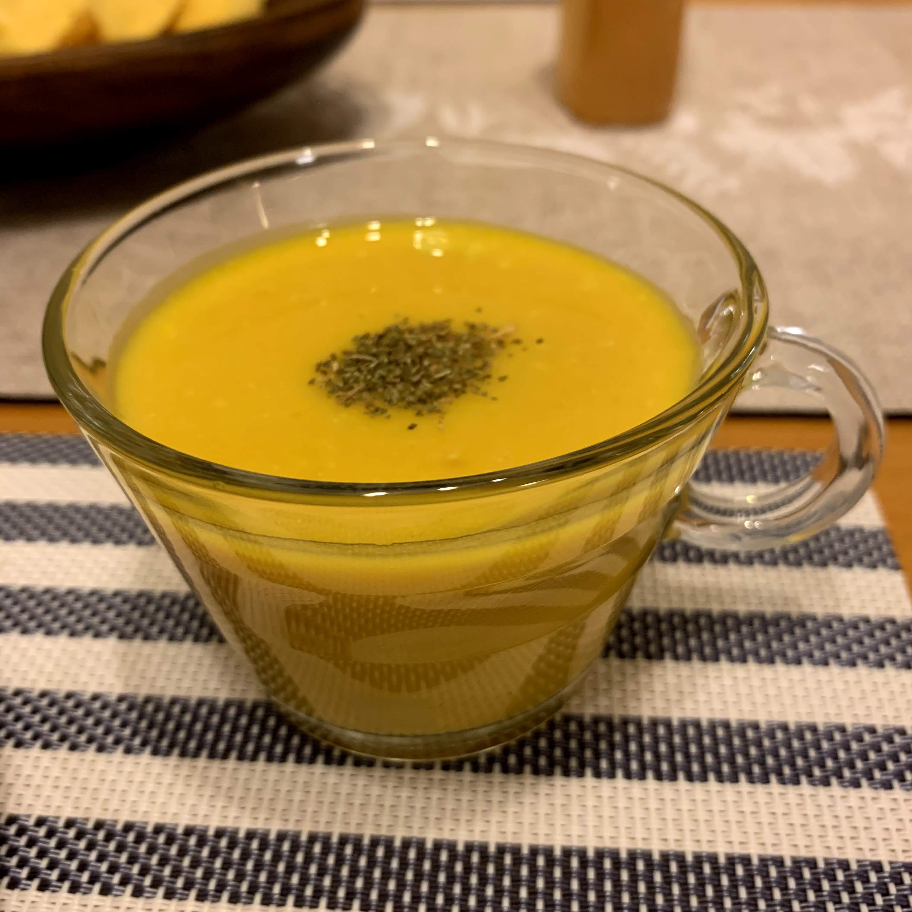 pumpkin soup in a glass cup