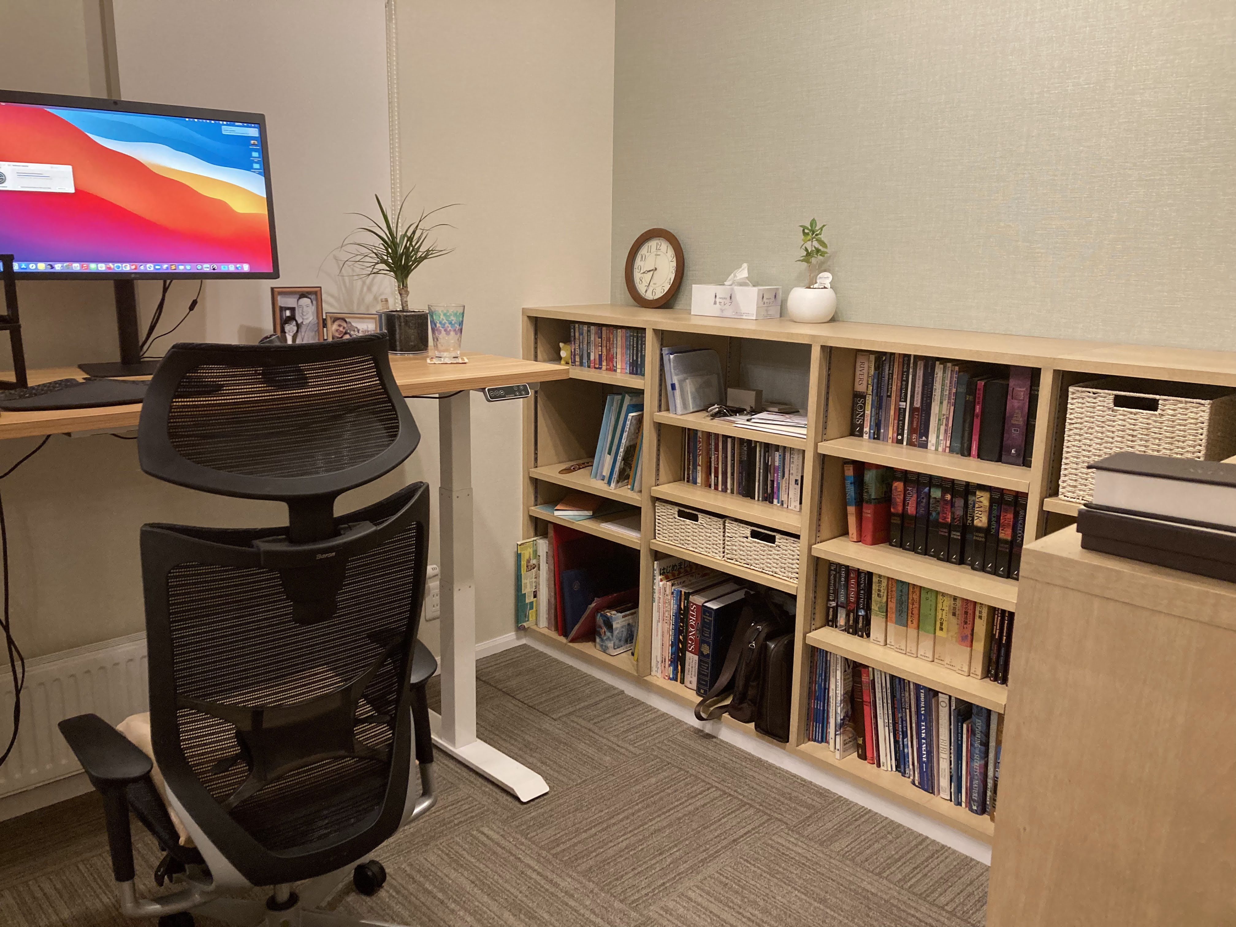 My new home office, with stand-up desk and bookshelves