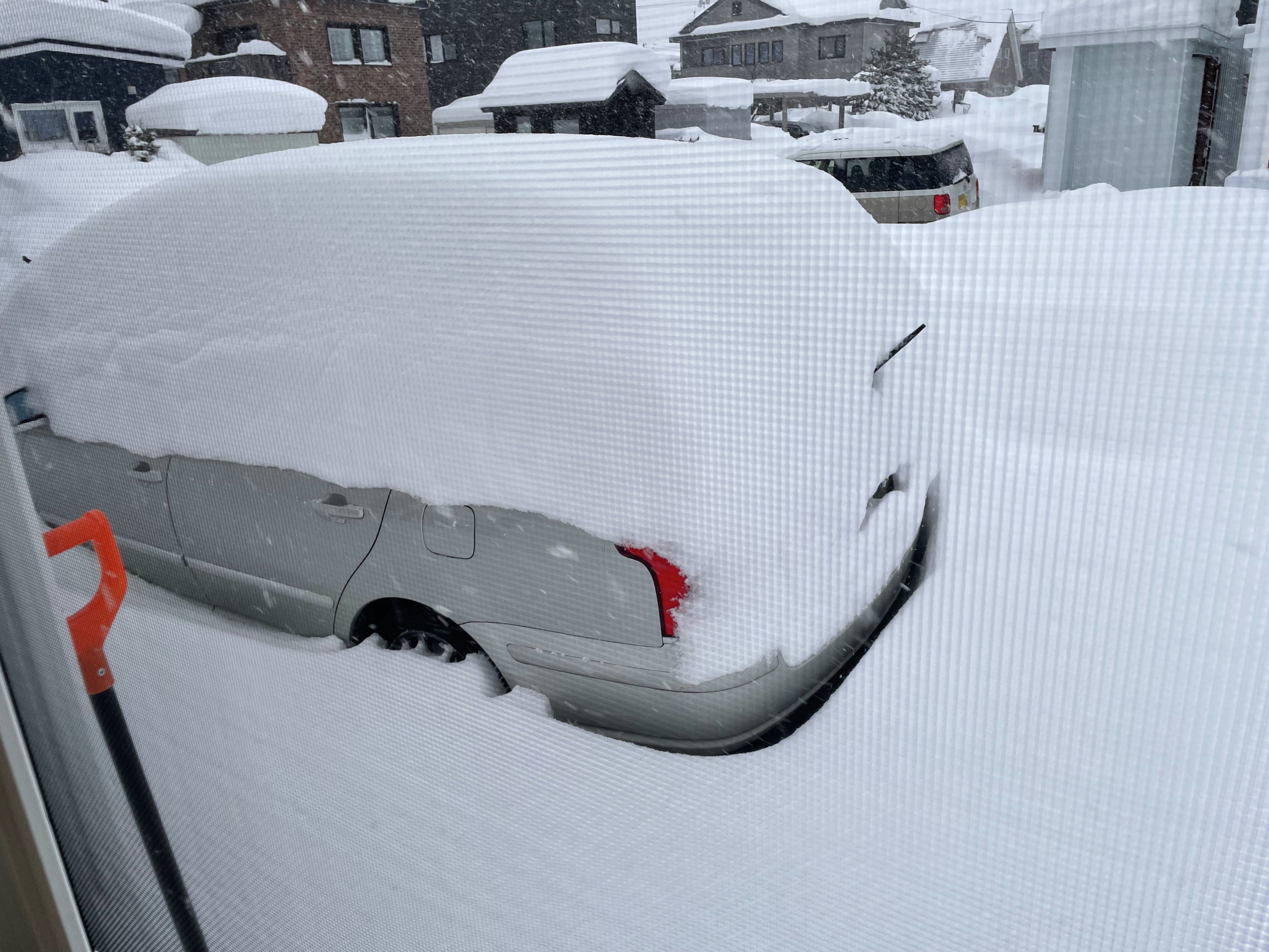 car covered in a foot of snow